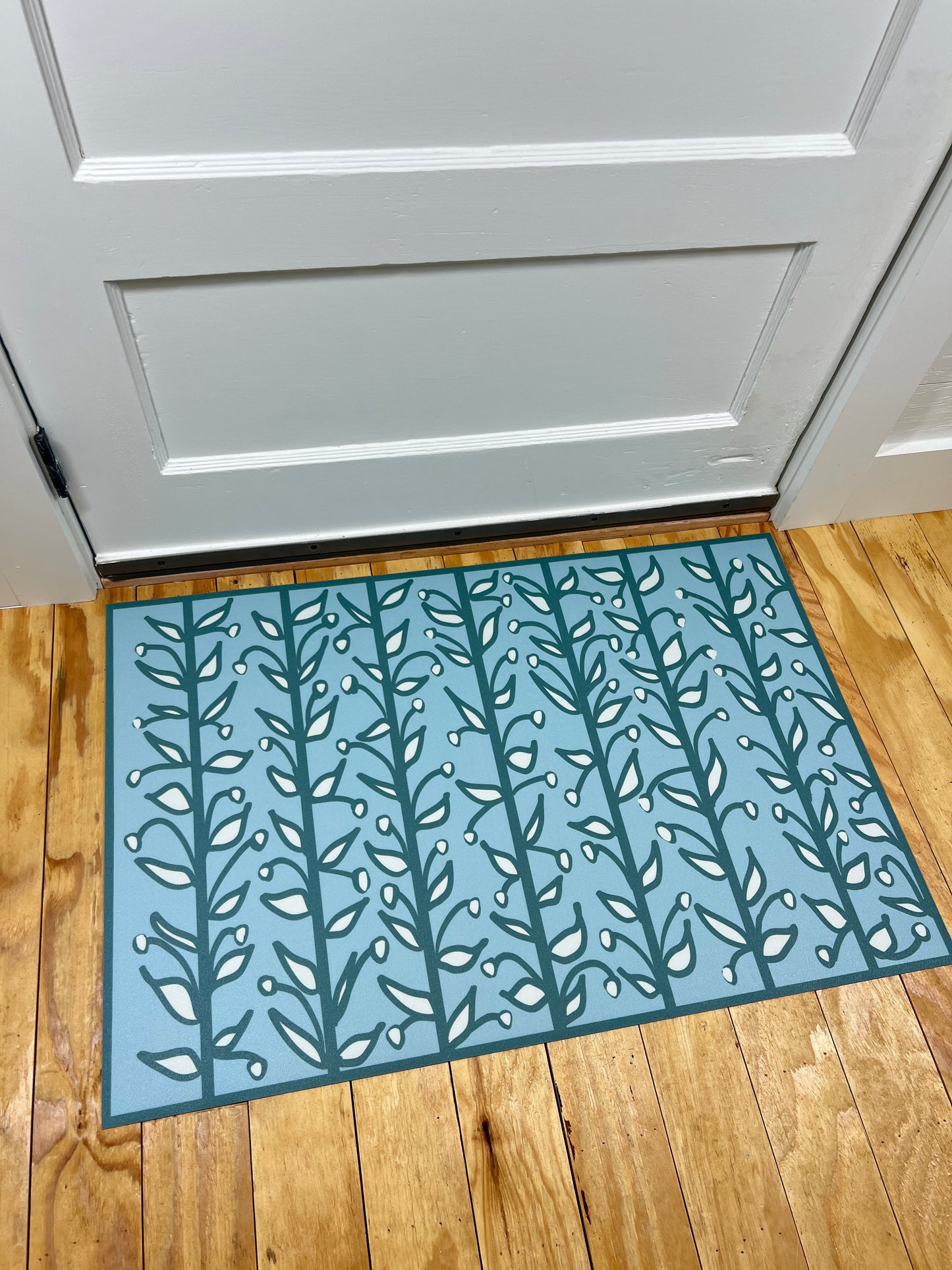 "Whoville" in Teal Fun Floral Vine Vinyl Mat- 24"x36"